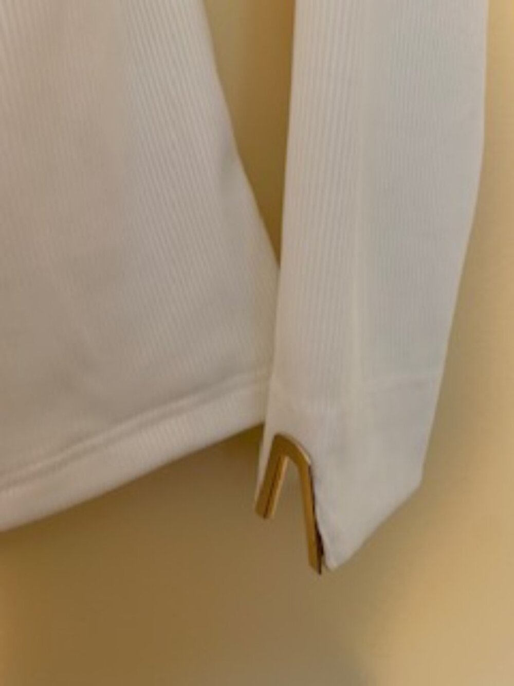 Pastel white top with gold/metal embellishing on top and arms. Size L - Picture 4 of 5